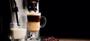 Coffee machine milk glass and beans heap