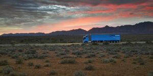 photo-startrack-fleet-semi-trailer-driving-through-outback-at-sunset.jpg.auspostimage.2000_0.medium